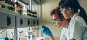Two people undertaking research in a lab