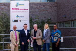 A photo showing: David Colman, CEO, University of Birmingham Enterprise Dr Richard Williams, CEO, Healome Therapeutics Ltd Richard Parker, Mayor of the West Midlands Dr Lisa Smith, CEO, Midlands Mindforge Claudia Whyte, Sjogren's UK outside the BioHub at the University of Birmingham